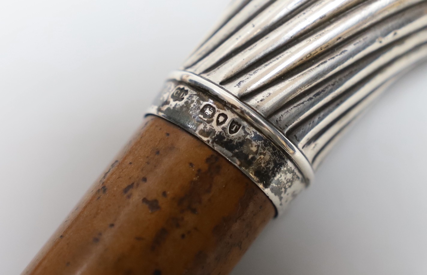 A silver-mounted malacca walking cane and a silver-mounted walking stick, 88cm